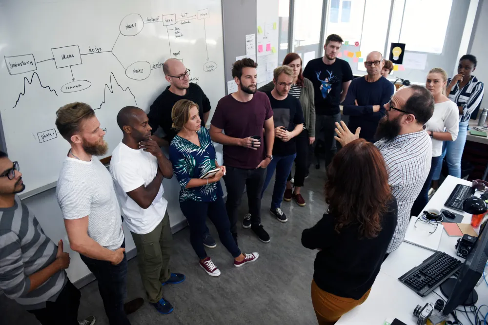 Team members participating in a collaboration workshop